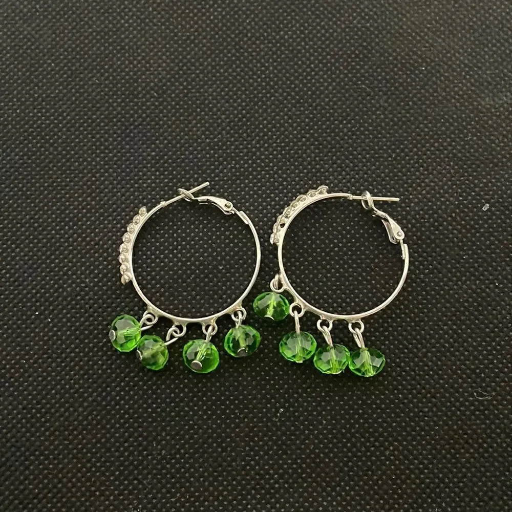 Small hoop earrings with green rhinestones